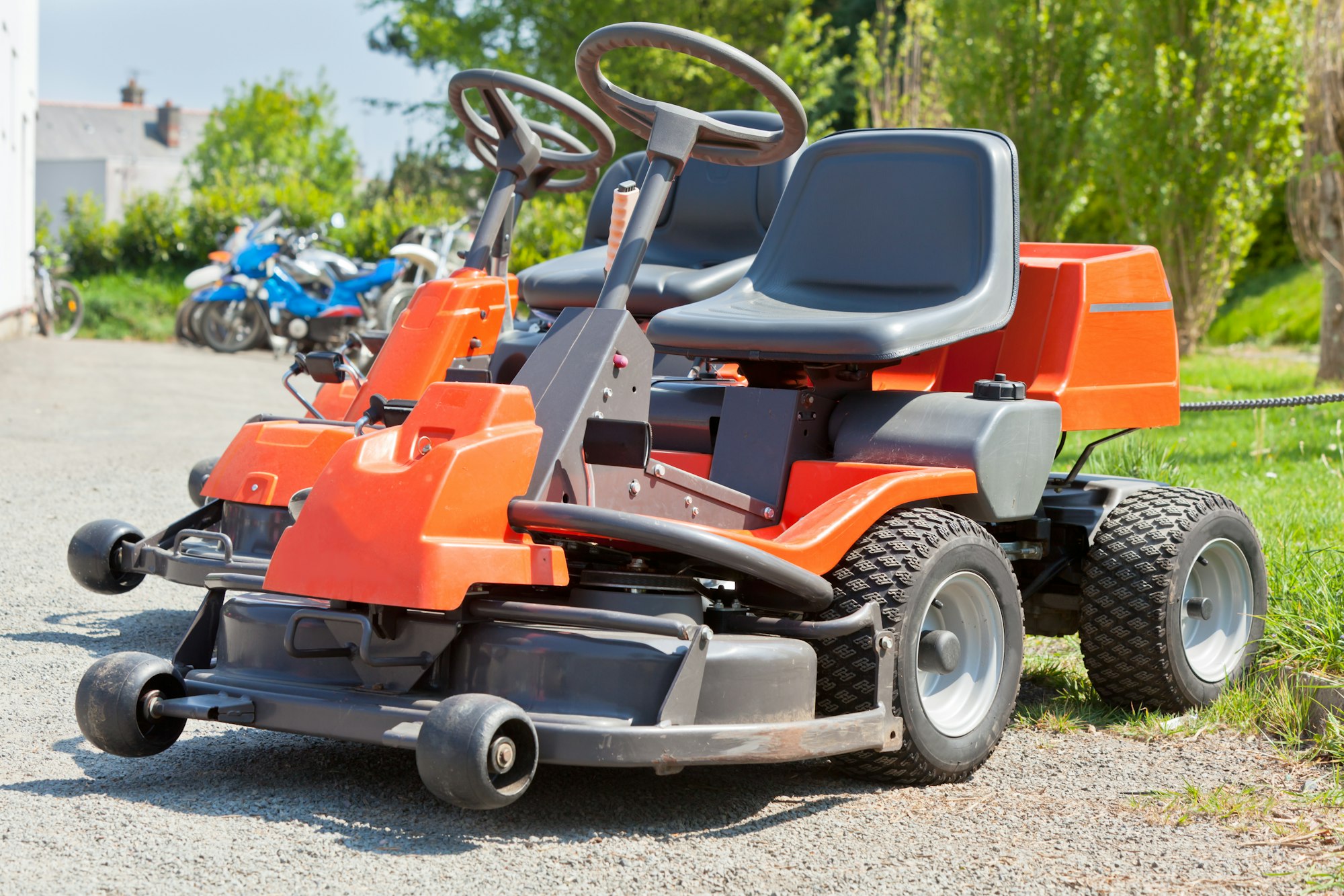 Professional lawn mowing equipment and red lawnmowers